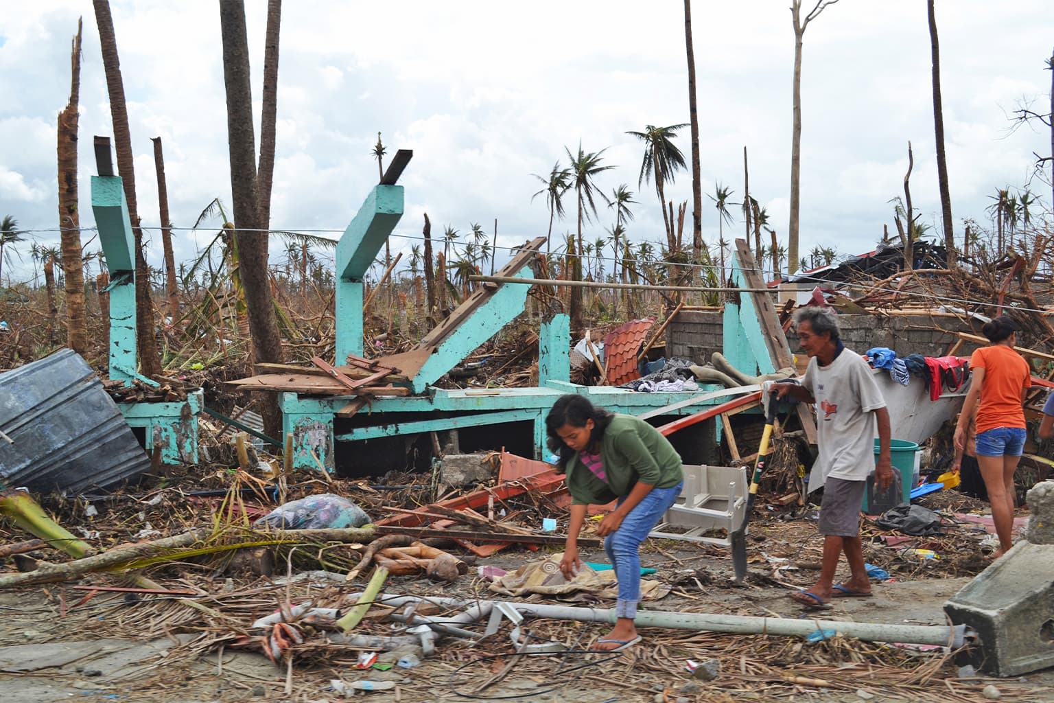 A destroyed house on the outskirts of Tacloban, the region worst affected by Typhon Haiyan in 2013. Image by Trócaire via Wikimedia Commons (CC BY 2.0).