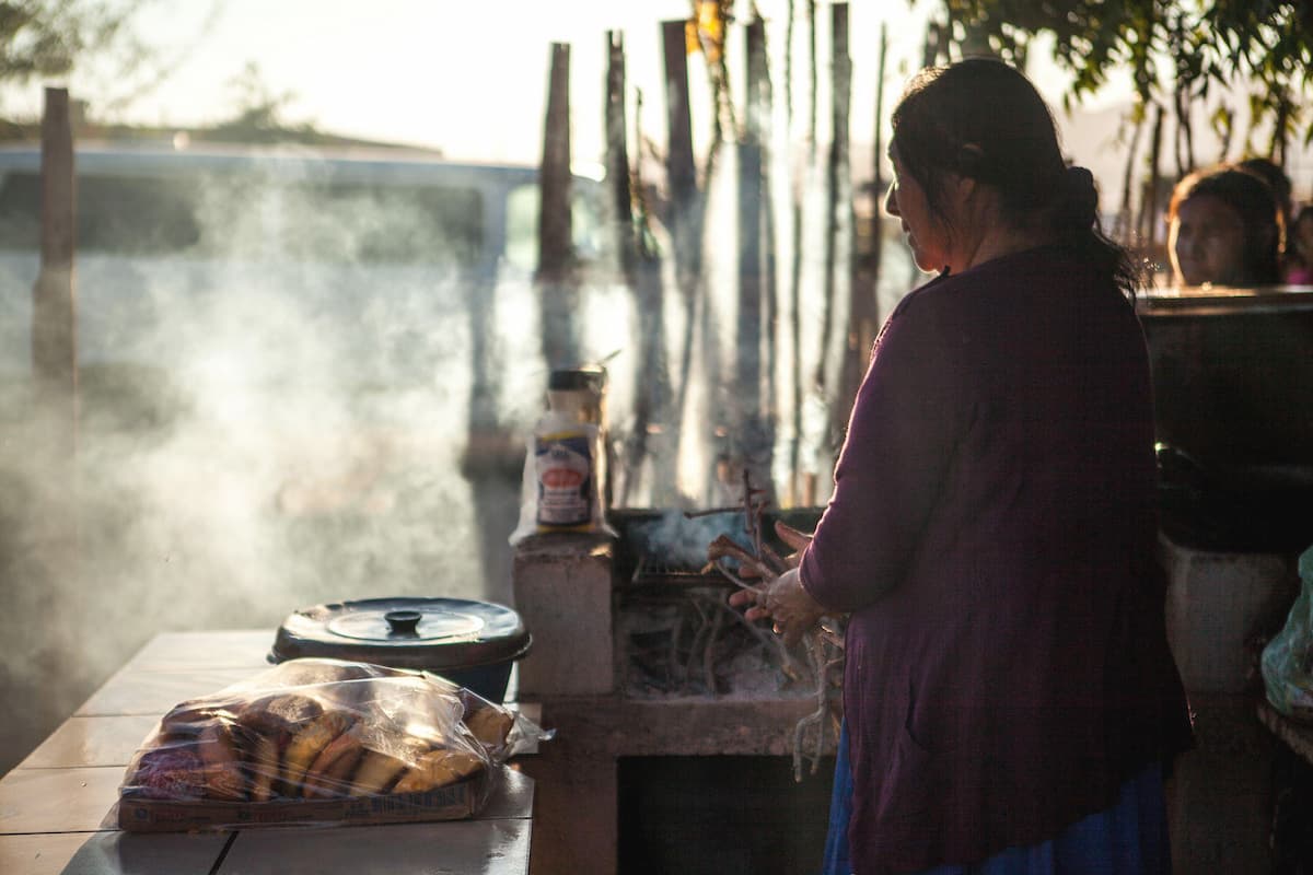 An Indigenous woman prepares food on a wood-burning stove in Punta Chueca, Sonora state, northern Mexico. Around 2-3% of Mexico’s 130 million people are still without electricity, say Israel Hurtado of the Mexican Hydrogen and Energy Transition Association (Image: Antonio Cascio / Zuma Press / Alamy)