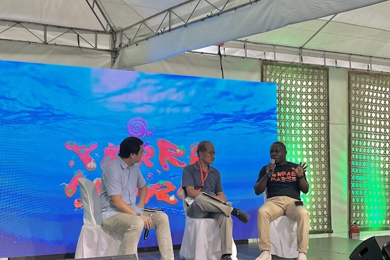 Edward Mukiibi, president of Slow Food (far right), discusses the ecological and social implications of GMOs during a panel at Terra Madre Asia & Pacific in Bacolod City, Philippines. Image by Keith Anthony Fabro for Mongabay.
