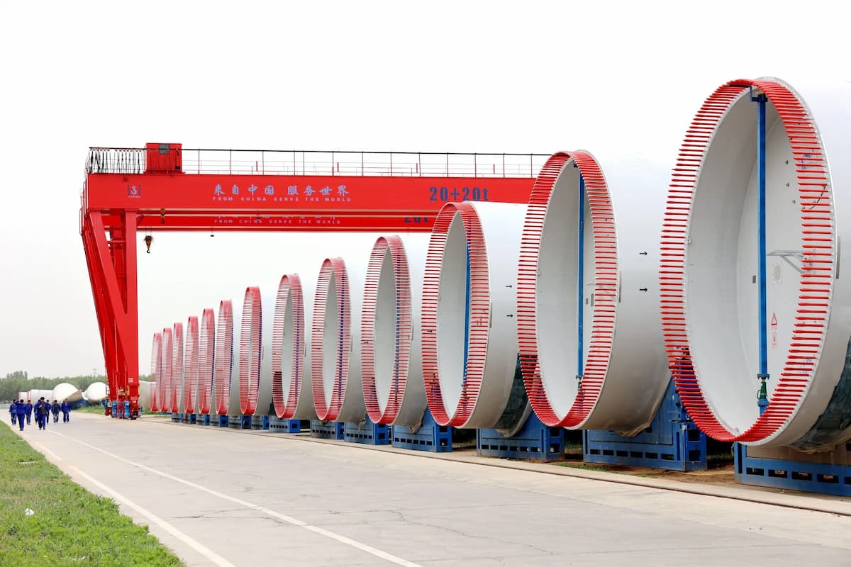 Wind turbine blades at a manufacturing site in Binzhou, east China. Blades are among the hardest parts of wind farms to recycle (Image: Cynthia Lee / Alamy)