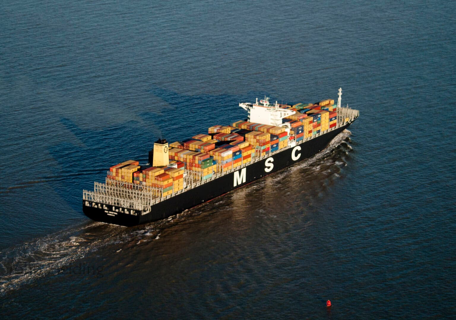 Marine shipping contributes about 2% of global carbon emissions. The U.N. International Maritime Organization (IMO) wants to achieve net zero by 2050, particularly by upping biofuel use (including renewable diesel), a move some environmental groups oppose. Image by John Fielding via Flickr (CC BY 2.0).